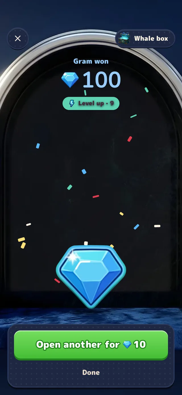 The Whale box result card: Gram won, 100, a large Gram coin, paper confetti and an Open another for 10 button